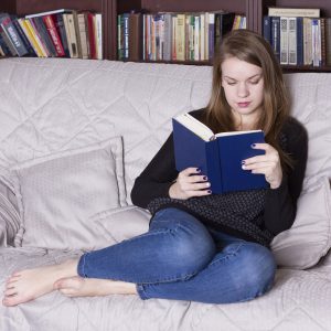 Woman at the library reading a book